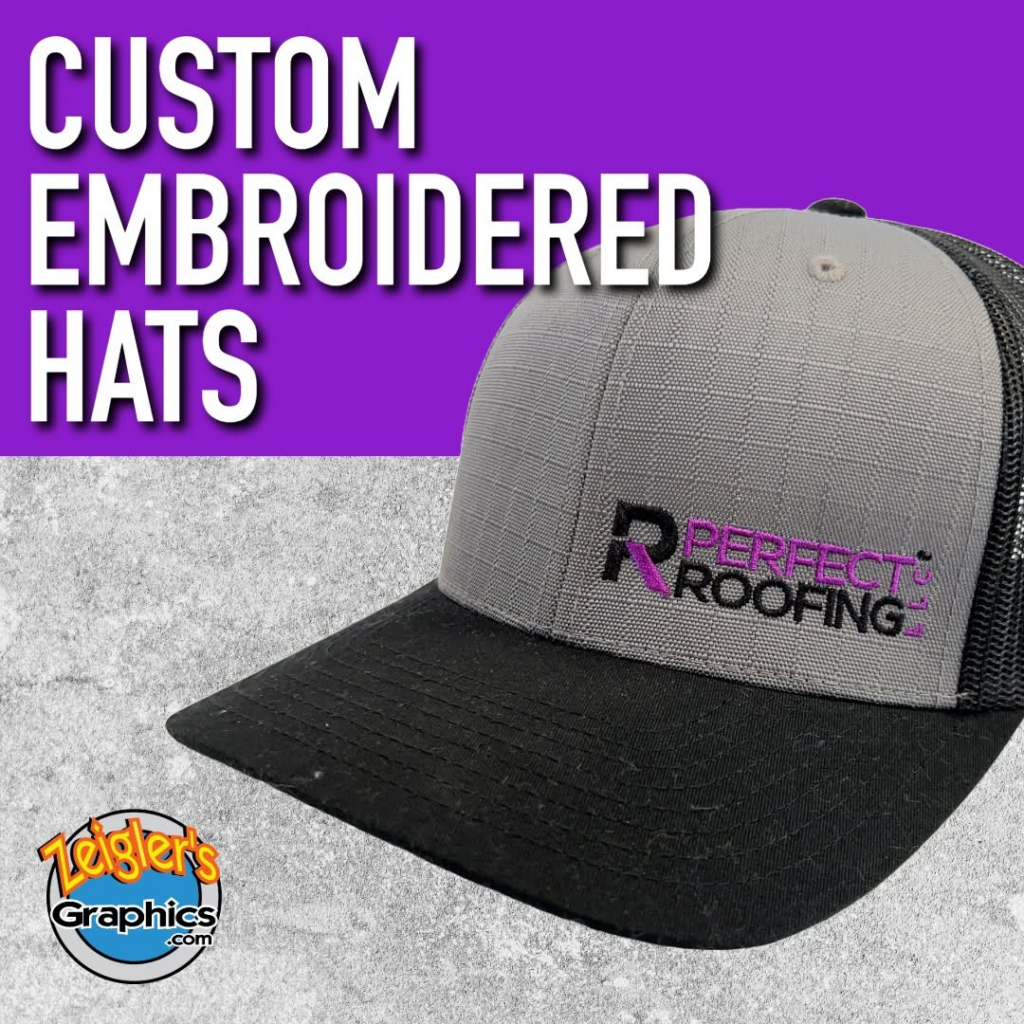 Gray and black cap embroidered with purple and black Perfect Roofing logo